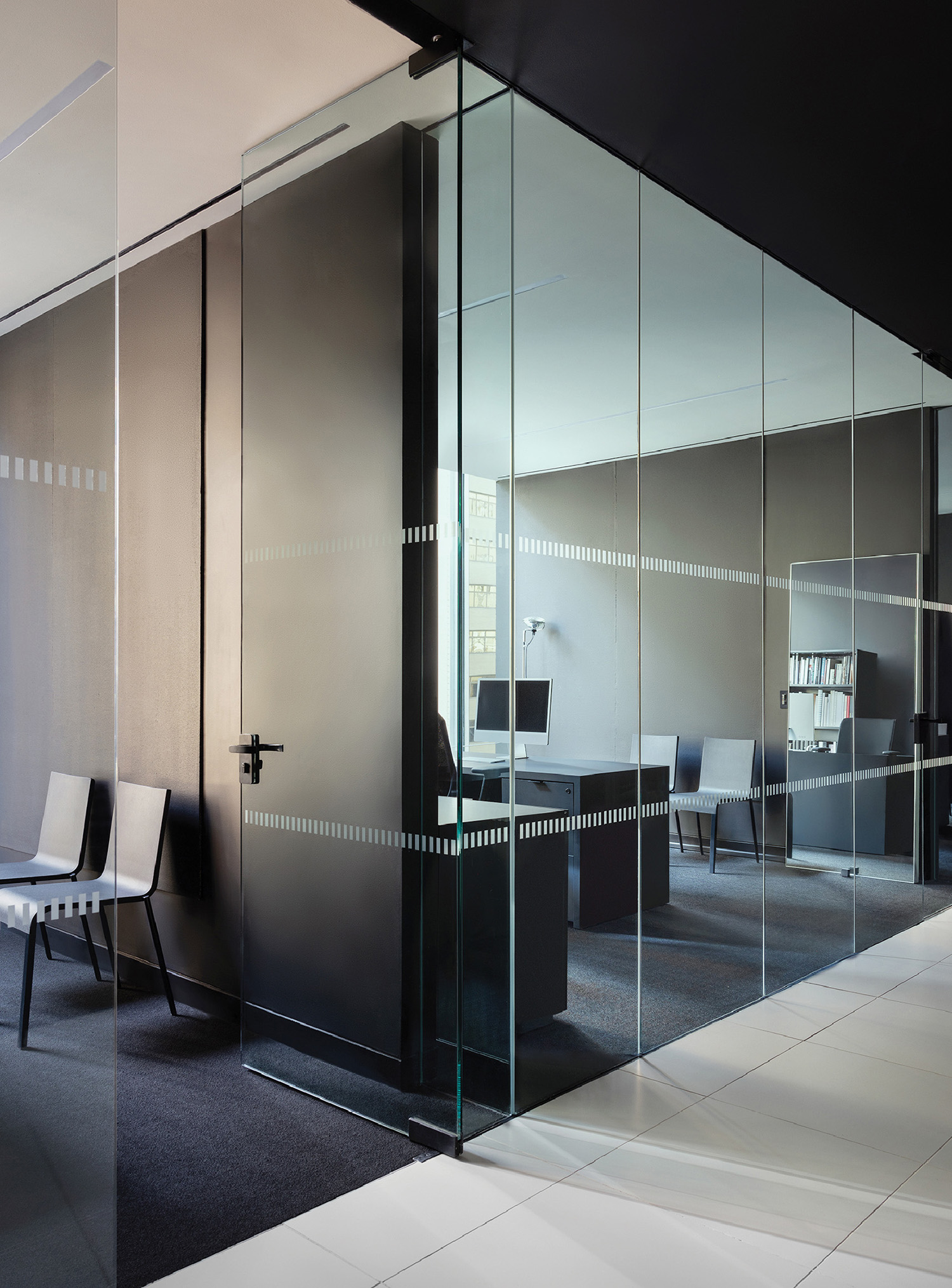 A glass wall in a modern office.