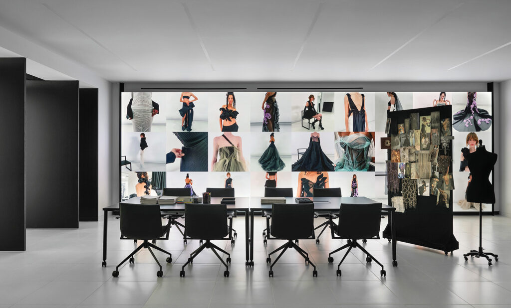 A room with a large display of clothes.
