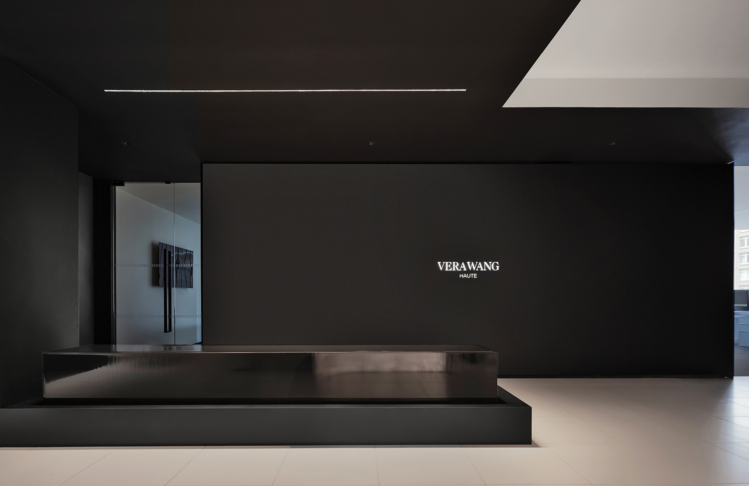A black and white room with a large television.