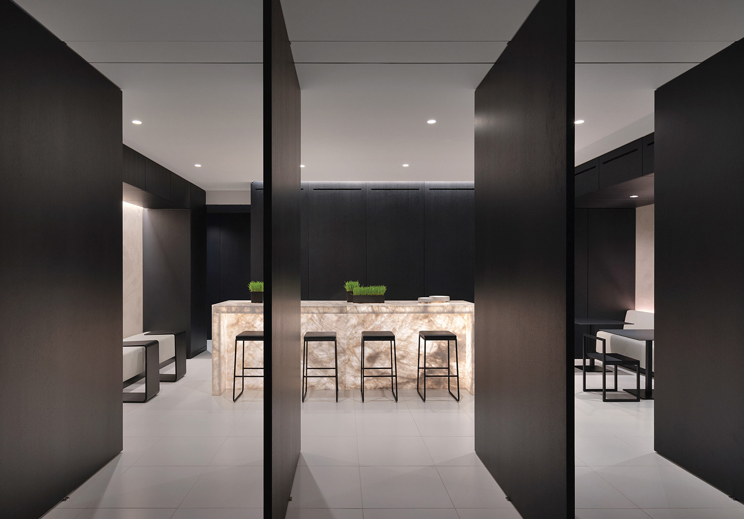 A kitchen with a bar and a dining area.
