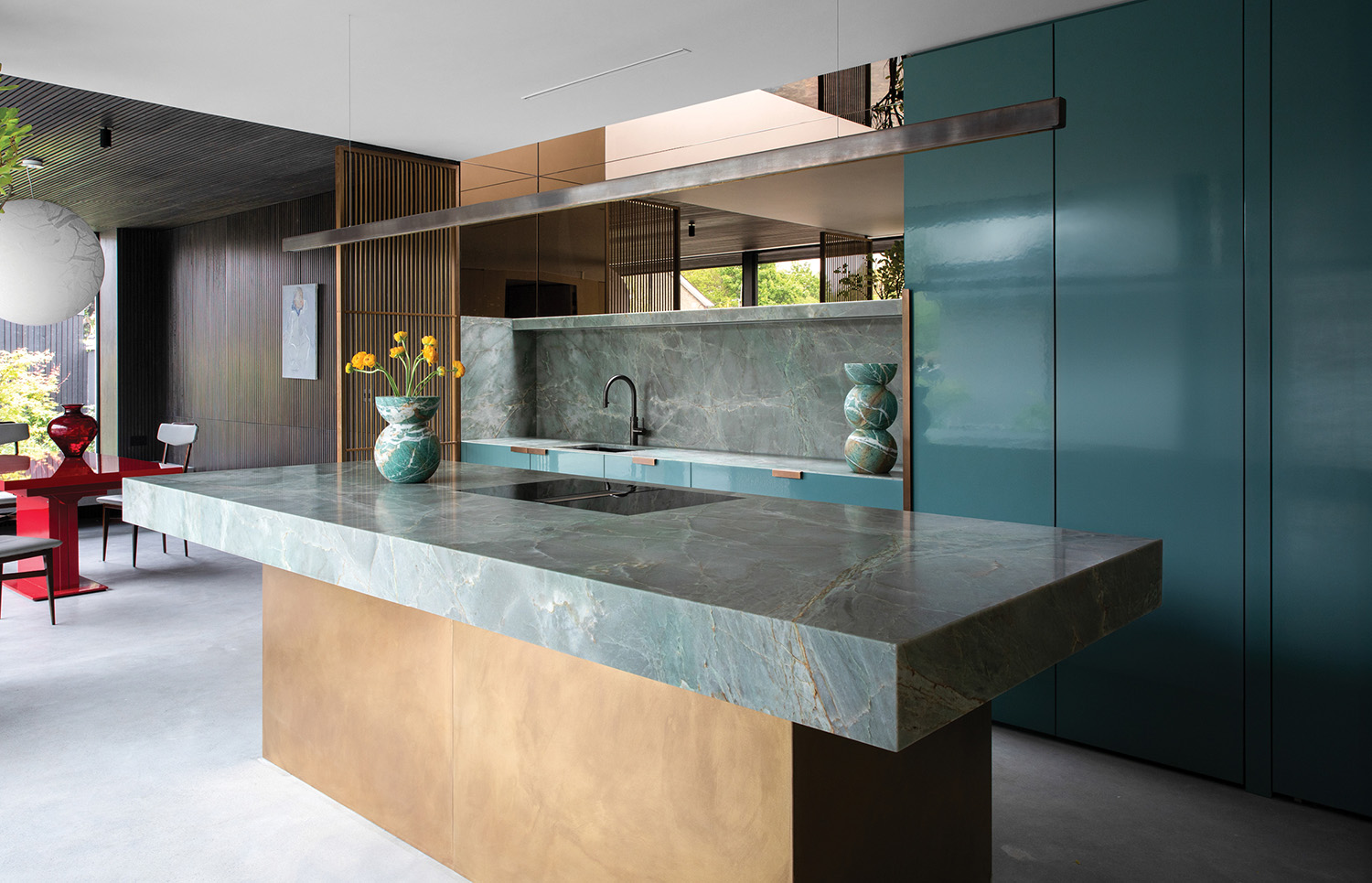 A kitchen with a marble counter top
