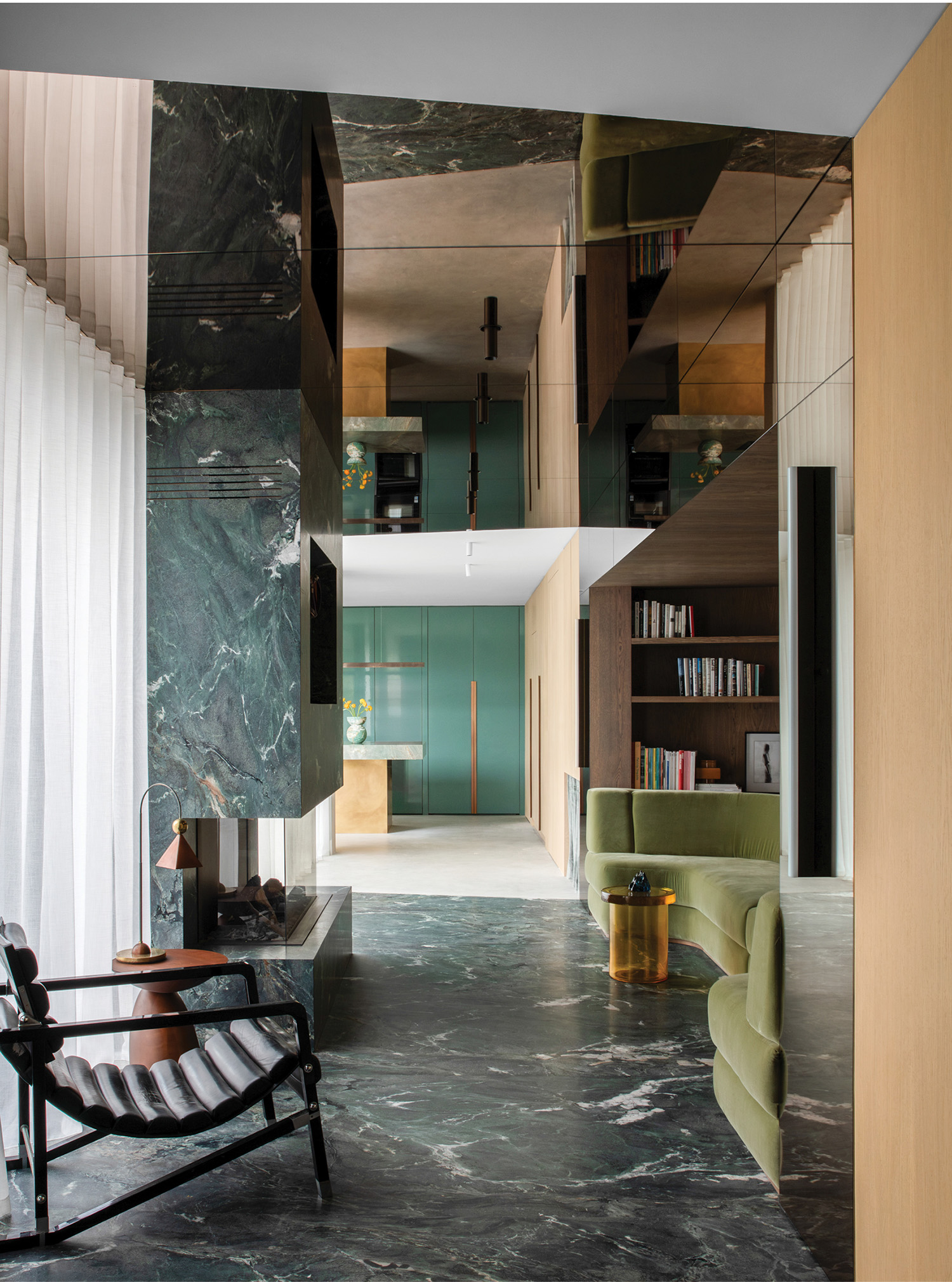 hallway with dark green marble and a chair