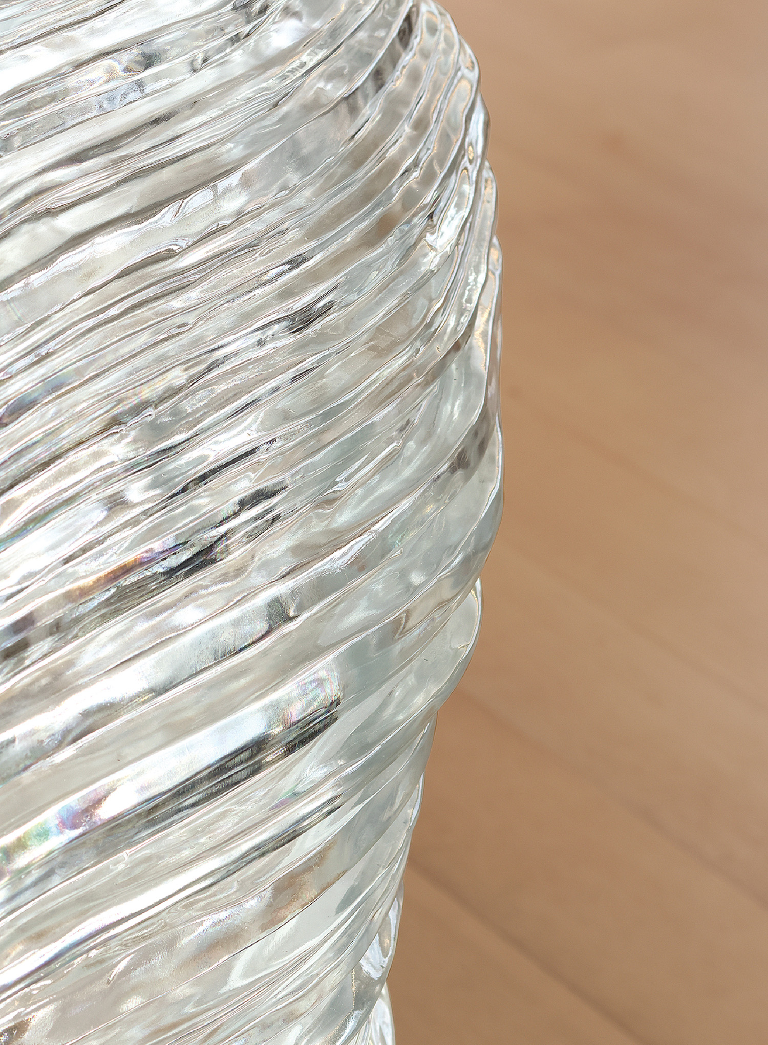 A close up of a water bottle on a wooden table.