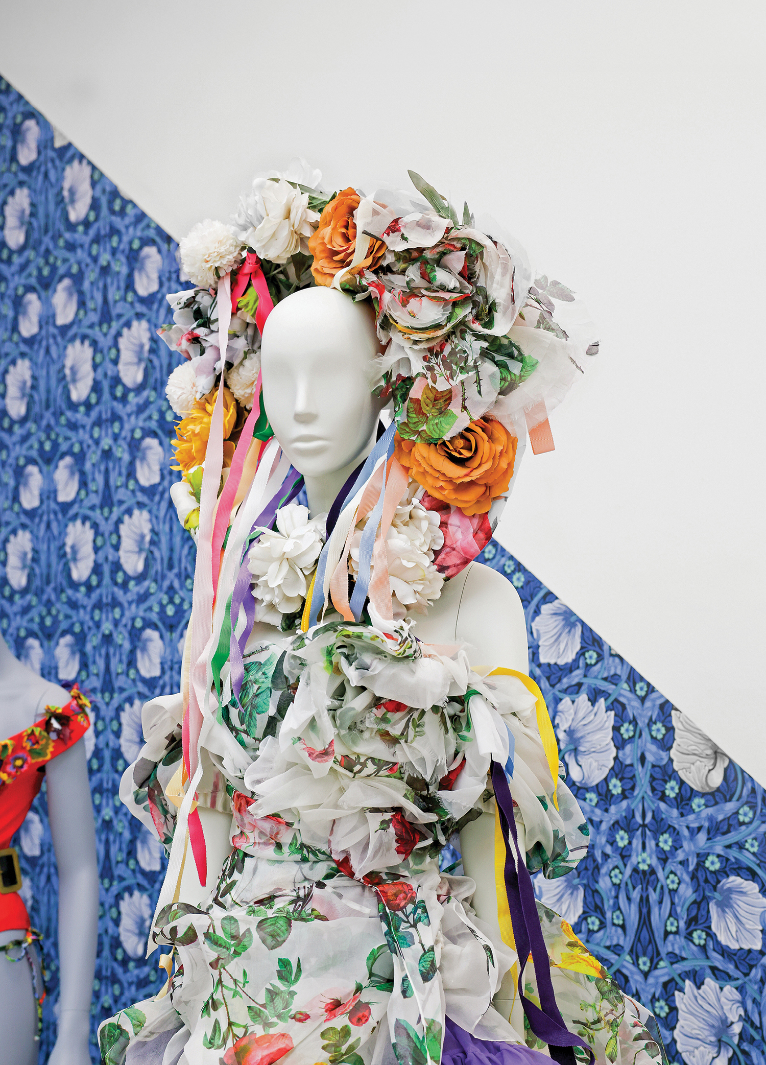 A manne with a lot of paper flowers on it.