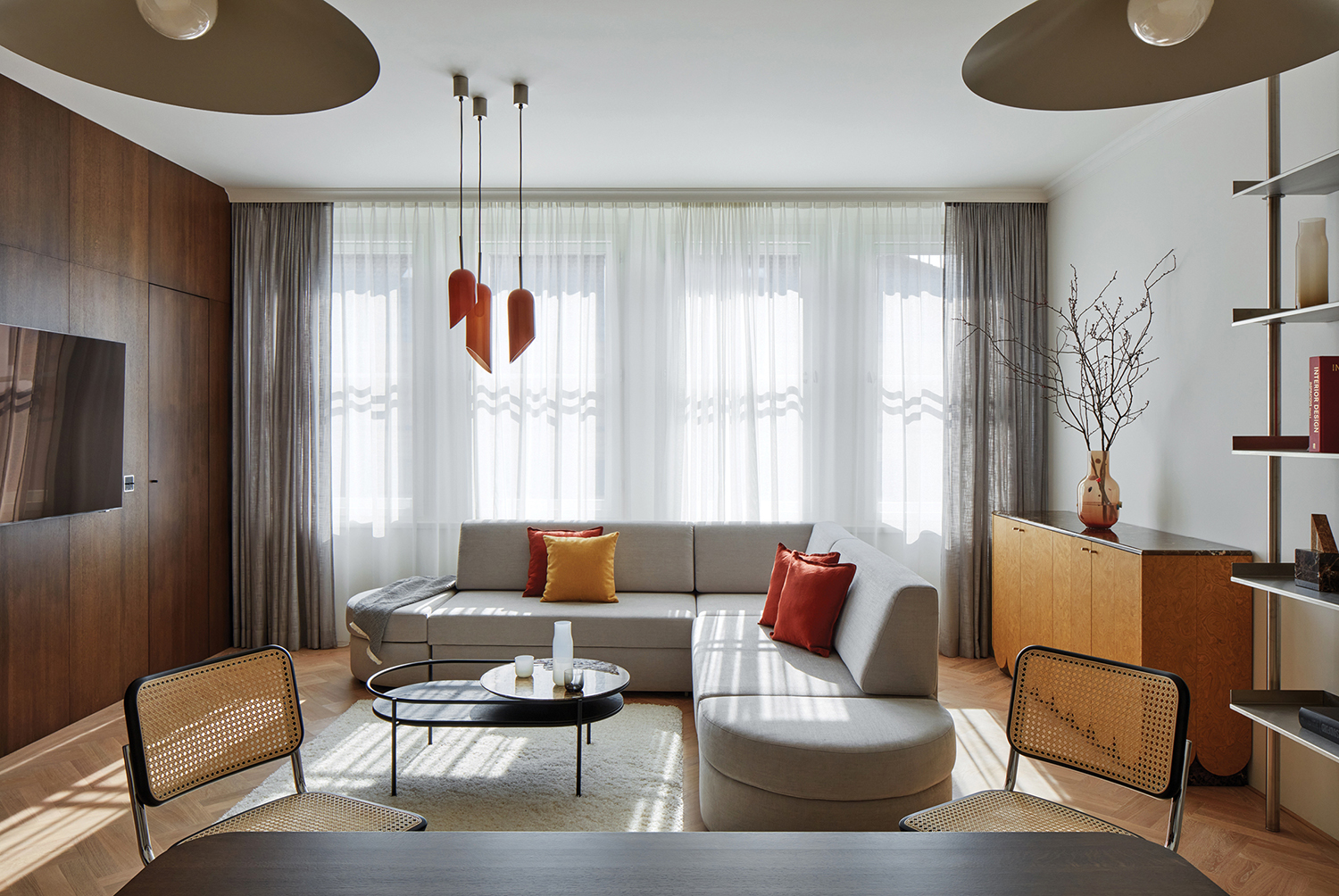 A living room with a couch and a table.