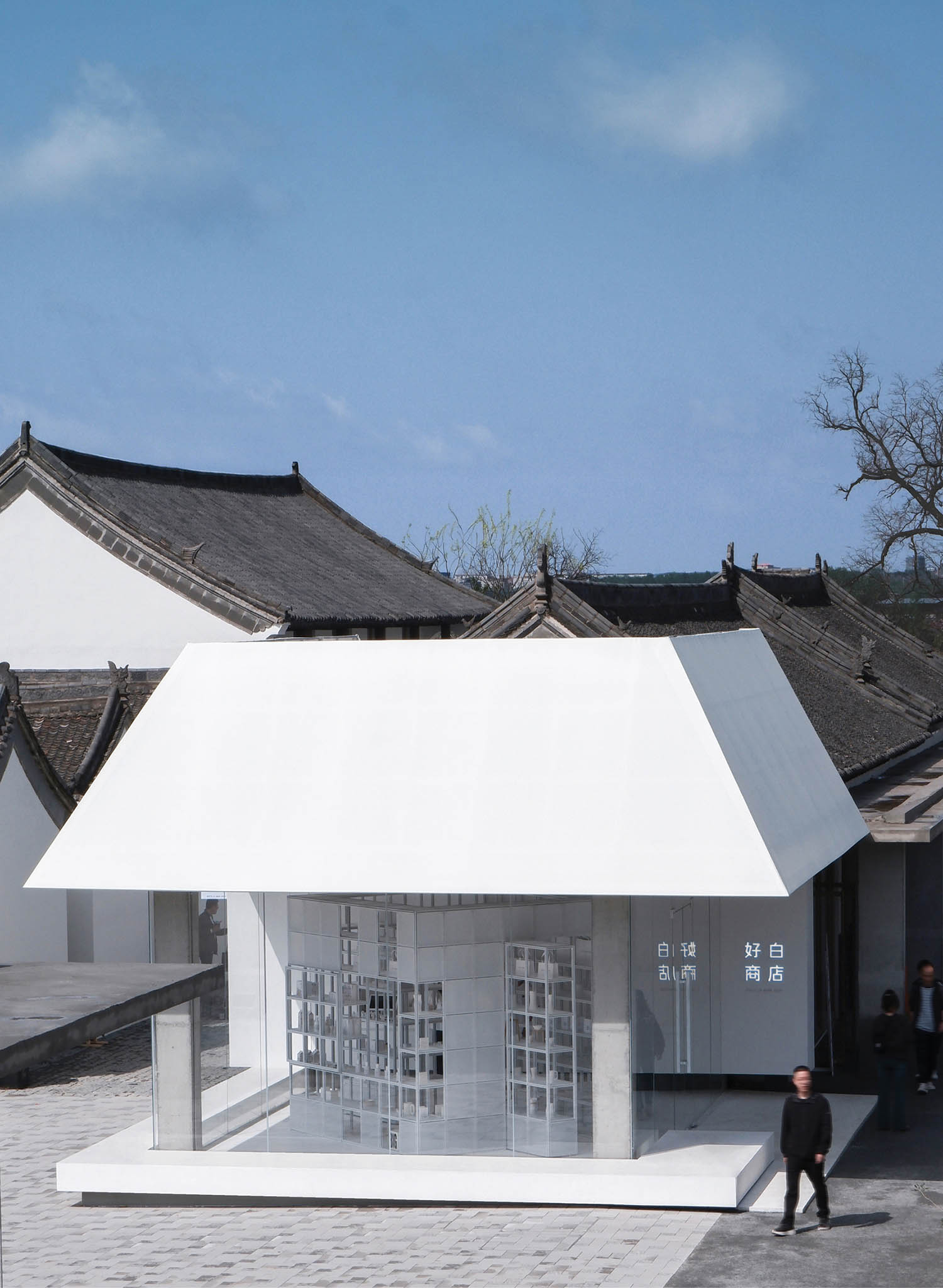 A white building with a white roof.