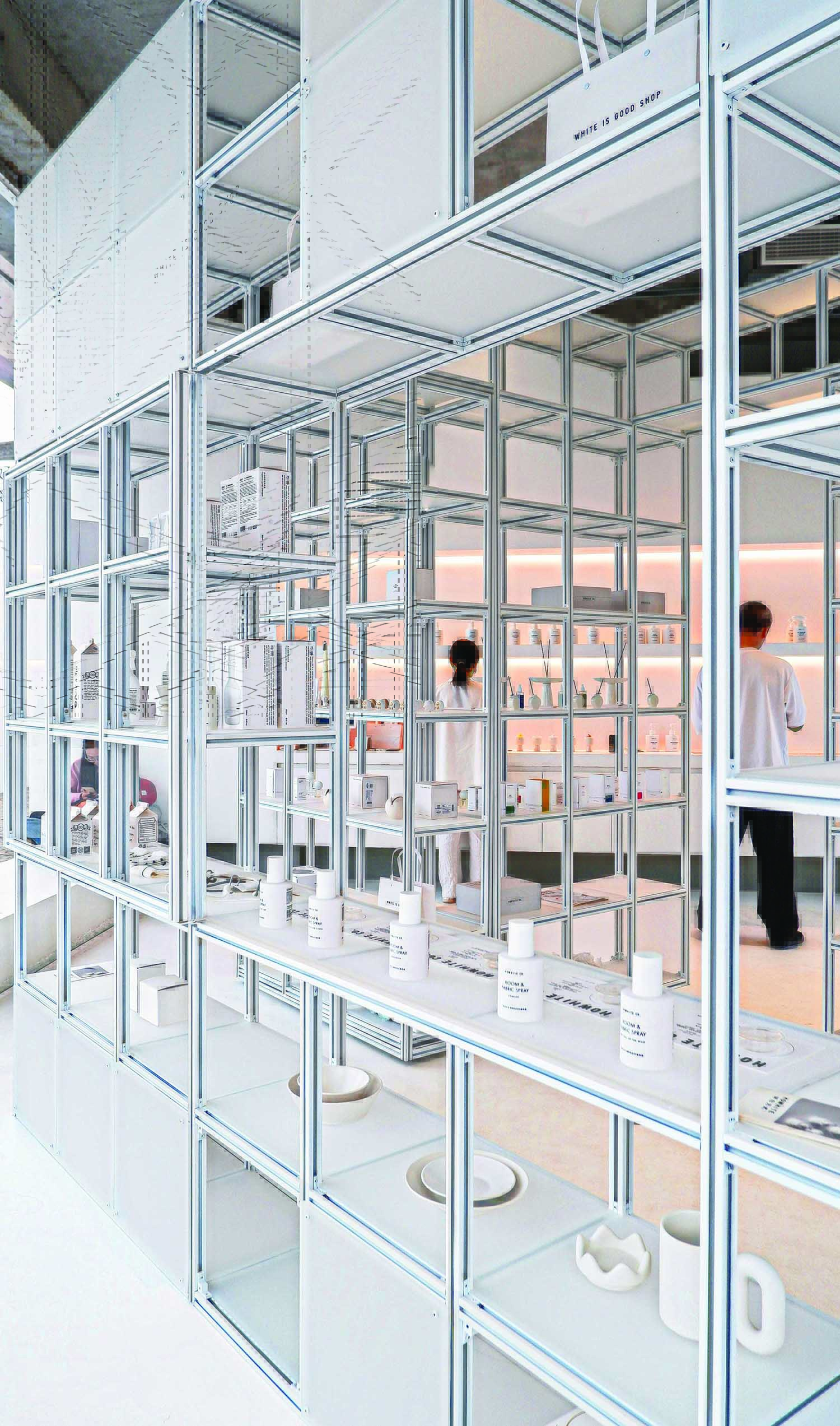 A white room with a bunch of shelves.