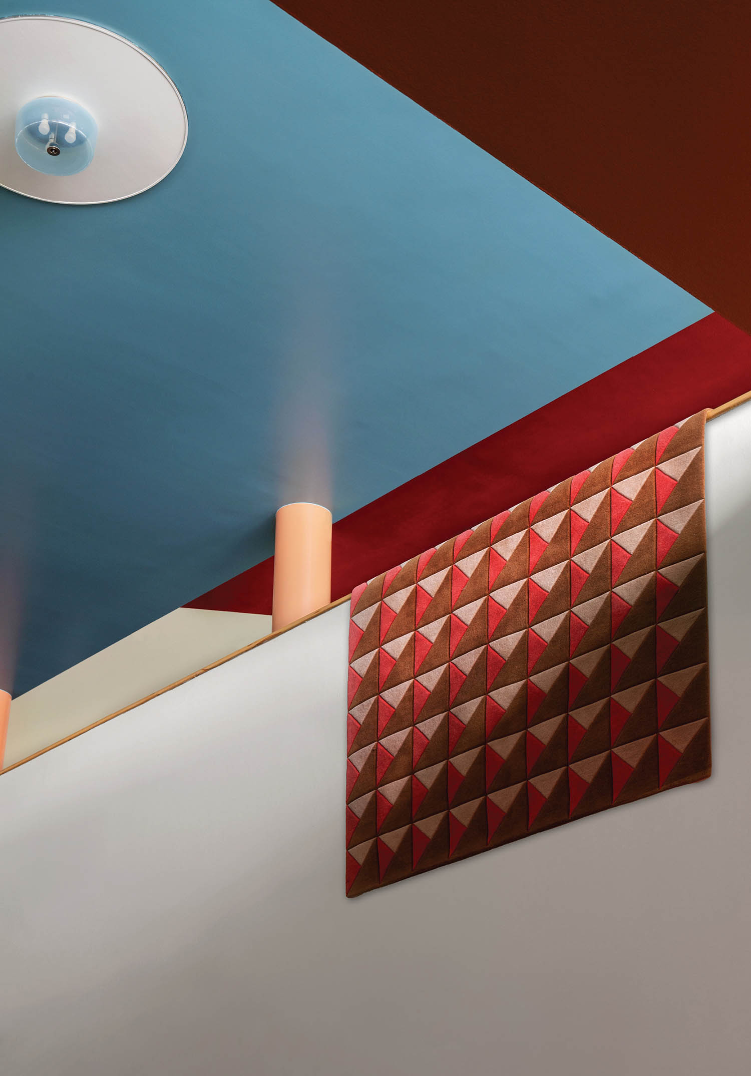 A room with a blue ceiling and a red wall.