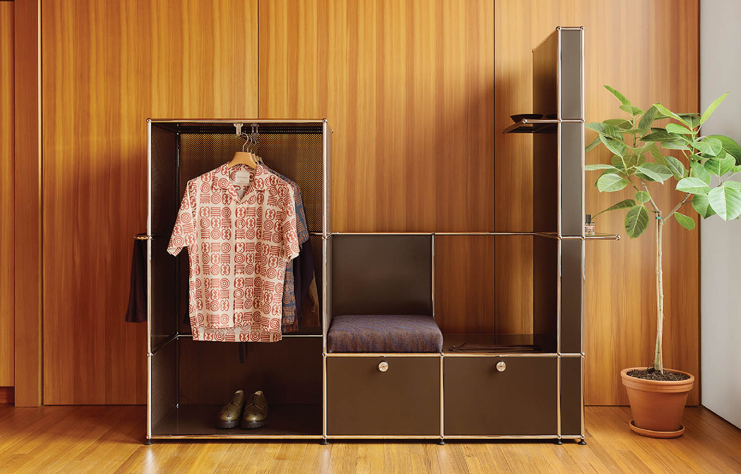 A wooden closet with a bed and a plant.