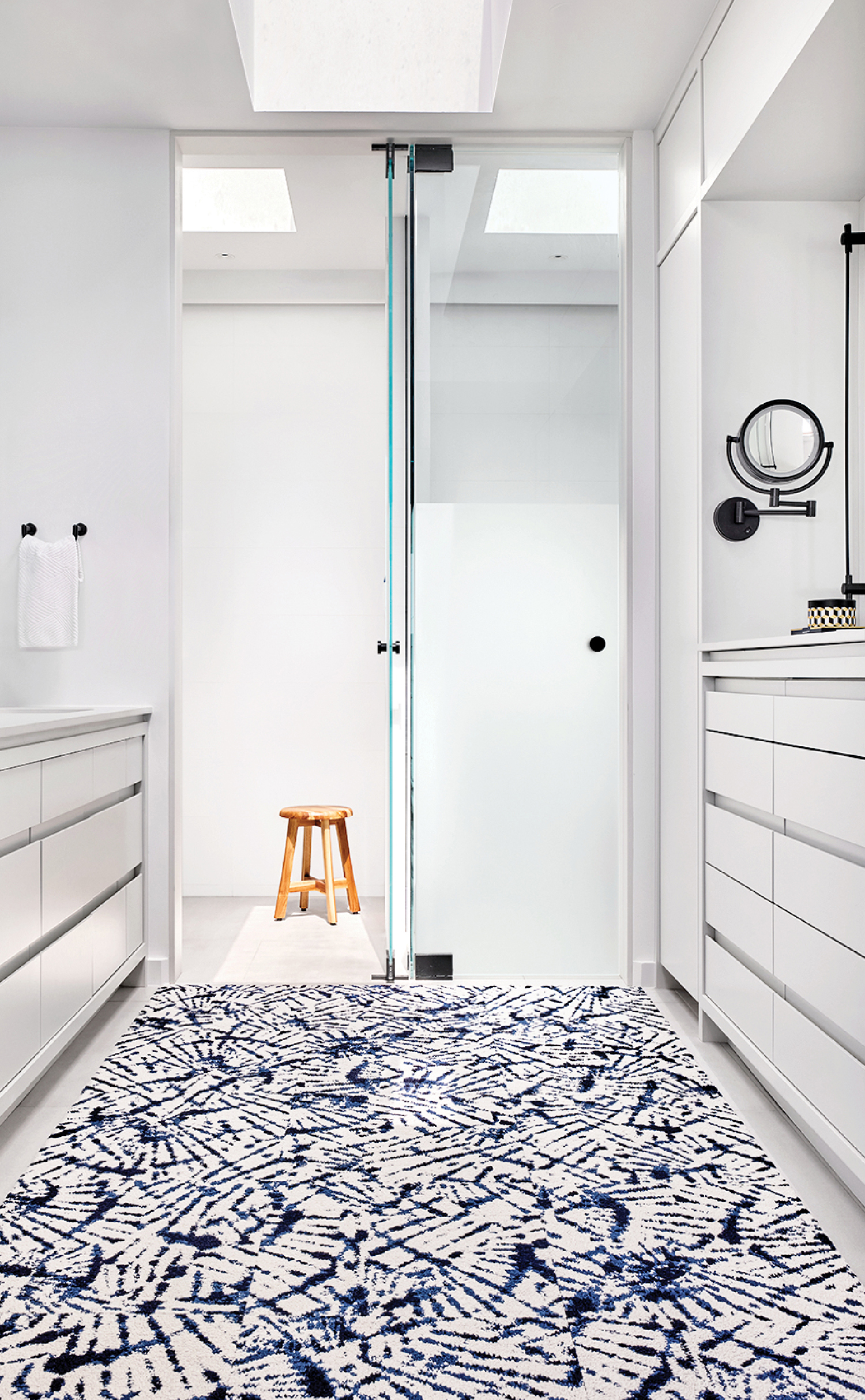 A bathroom with a blue and white patterned floor.