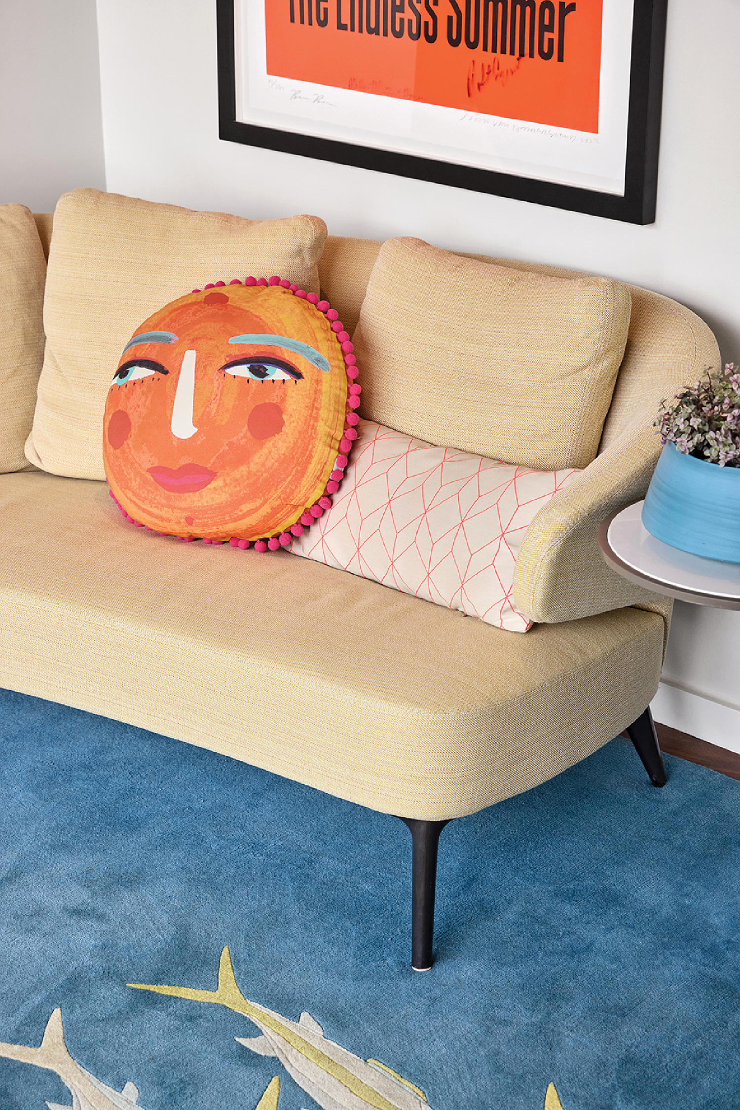 A couch with a pillow on it in a room.