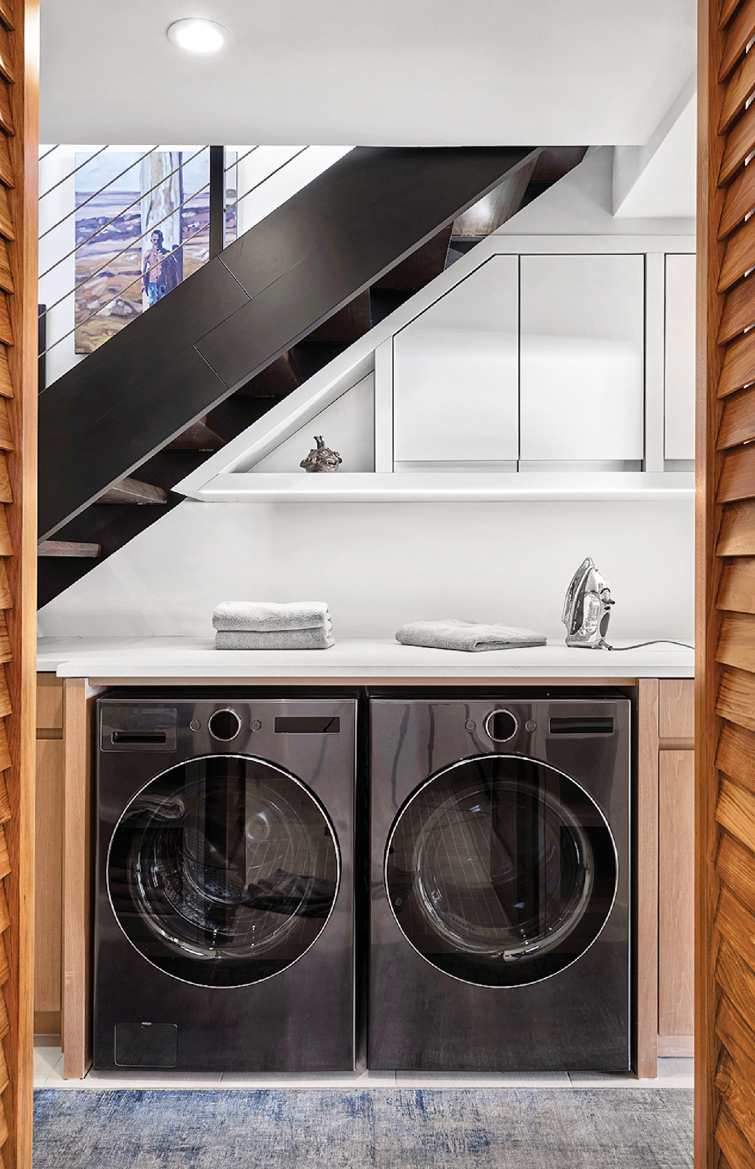 A laundry room with a washer and dryer.