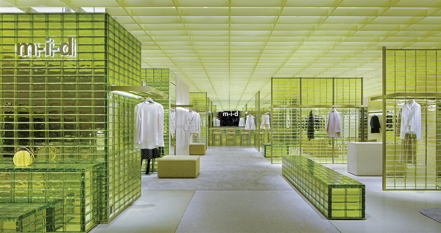 A store with a lot of green glass.