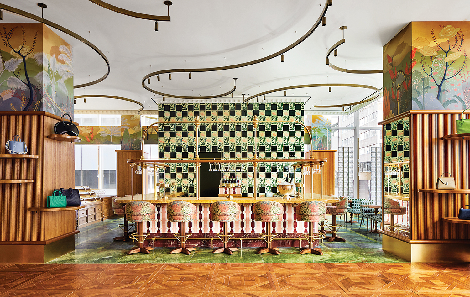 A room with a bar and a large mural.
