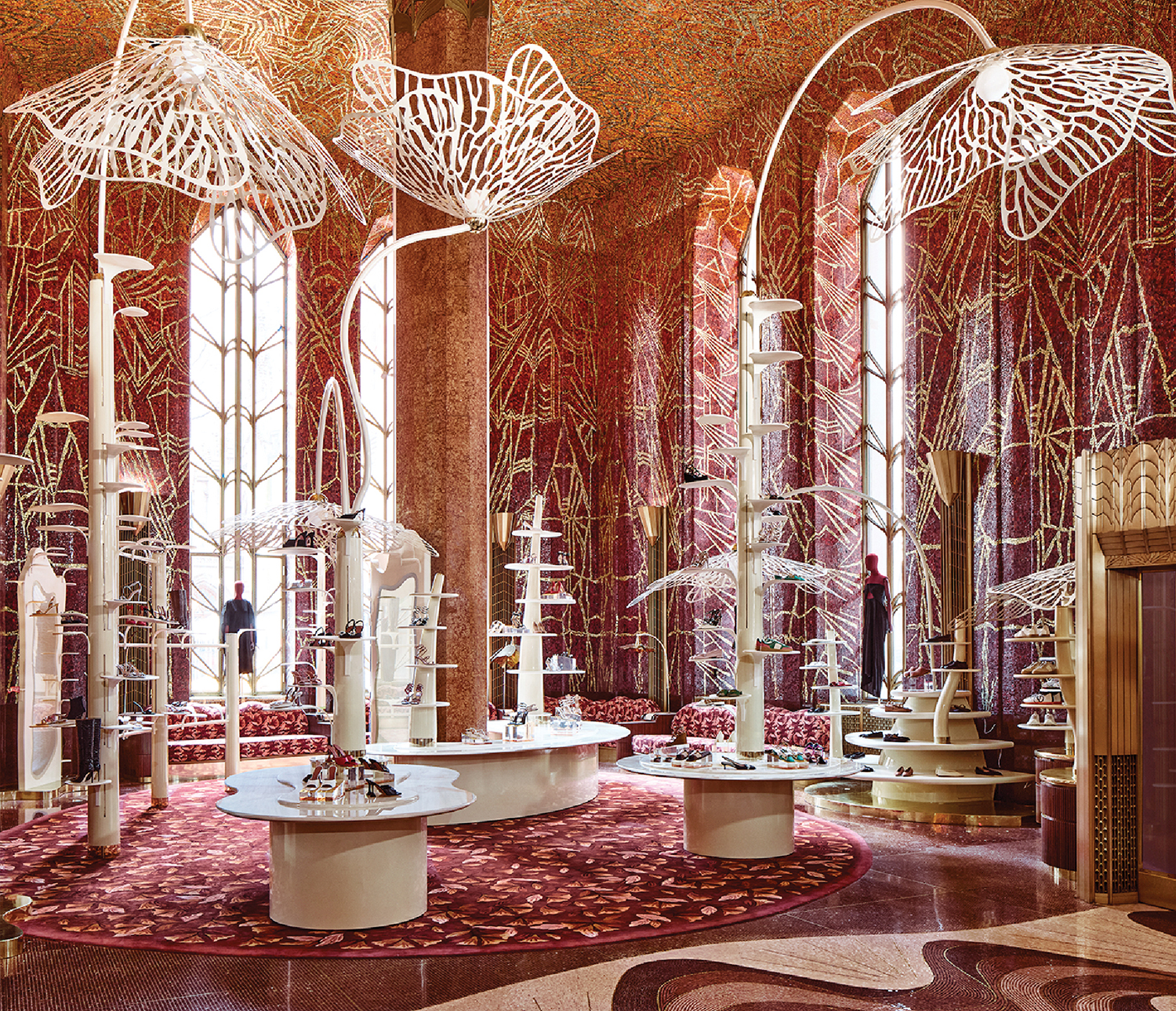 A room with a large carpet and a large ceiling.