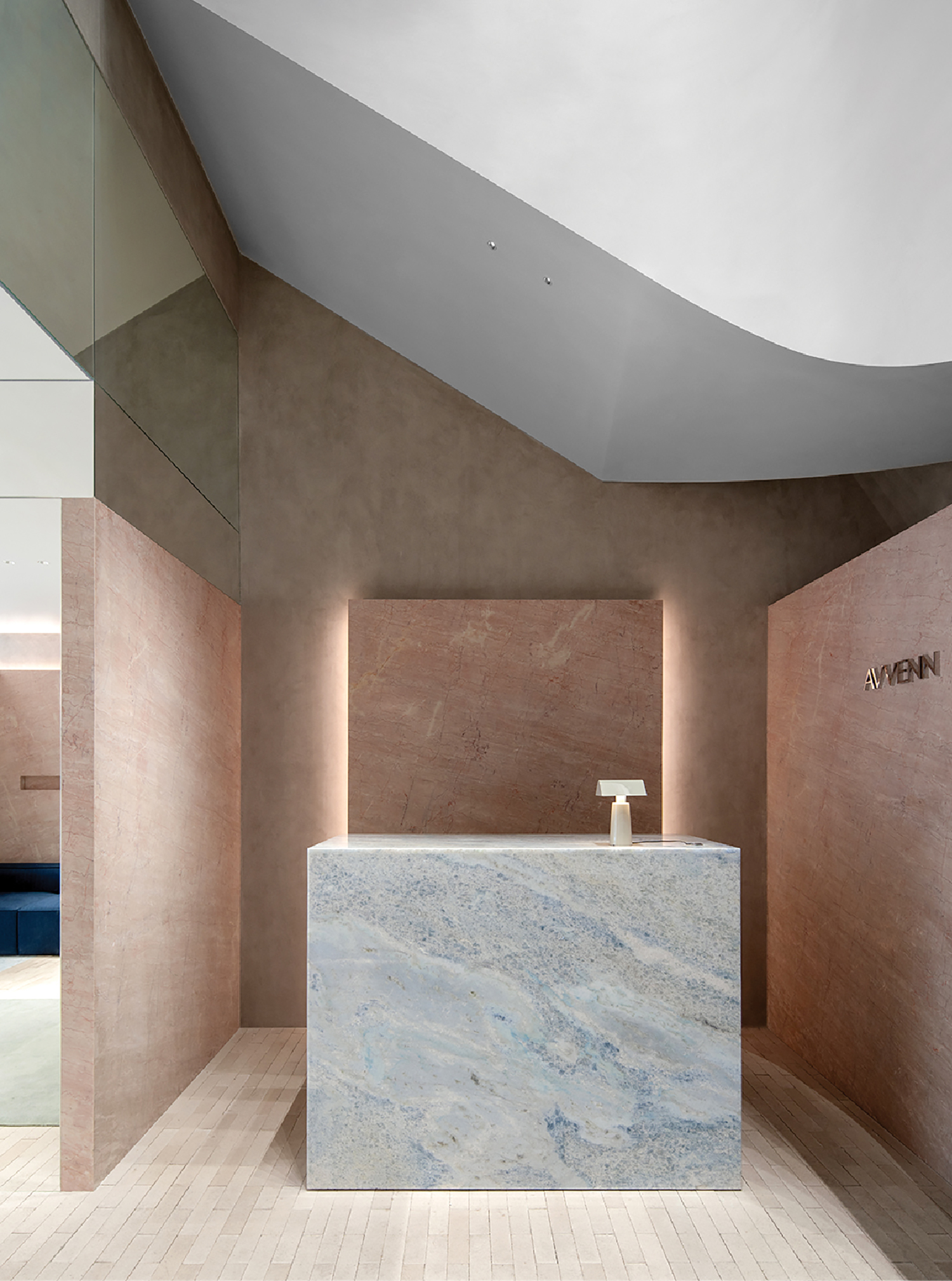 A marble counter in a modern bathroom.