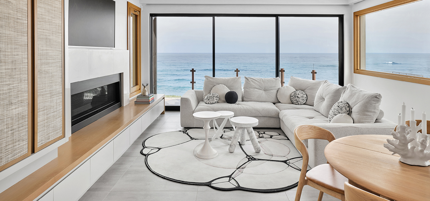 living room with window overlooking ocean