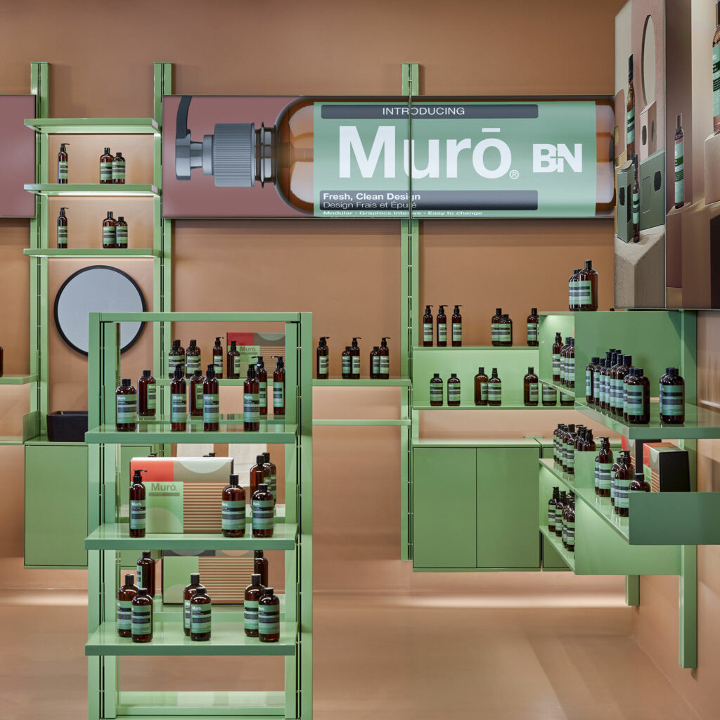 a shop with green shelving by B+N Industries
