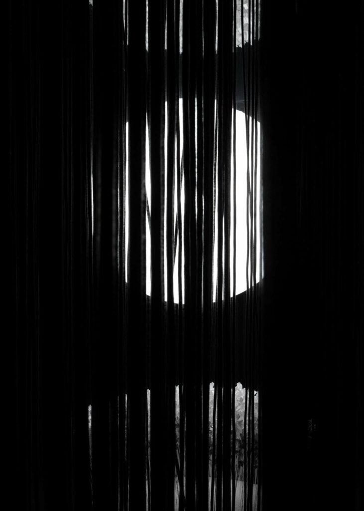 black ropes through circular windows