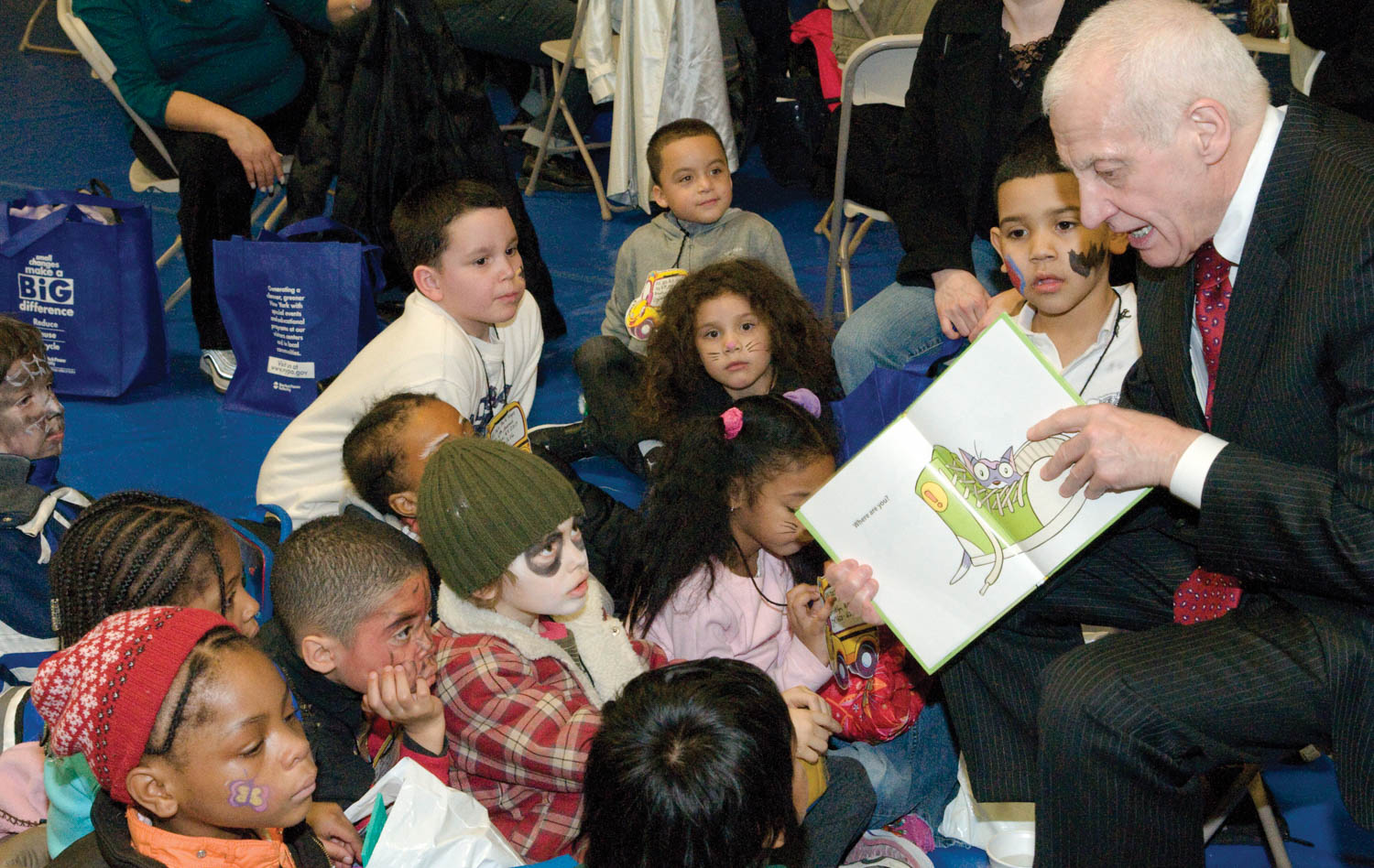 man reading to children