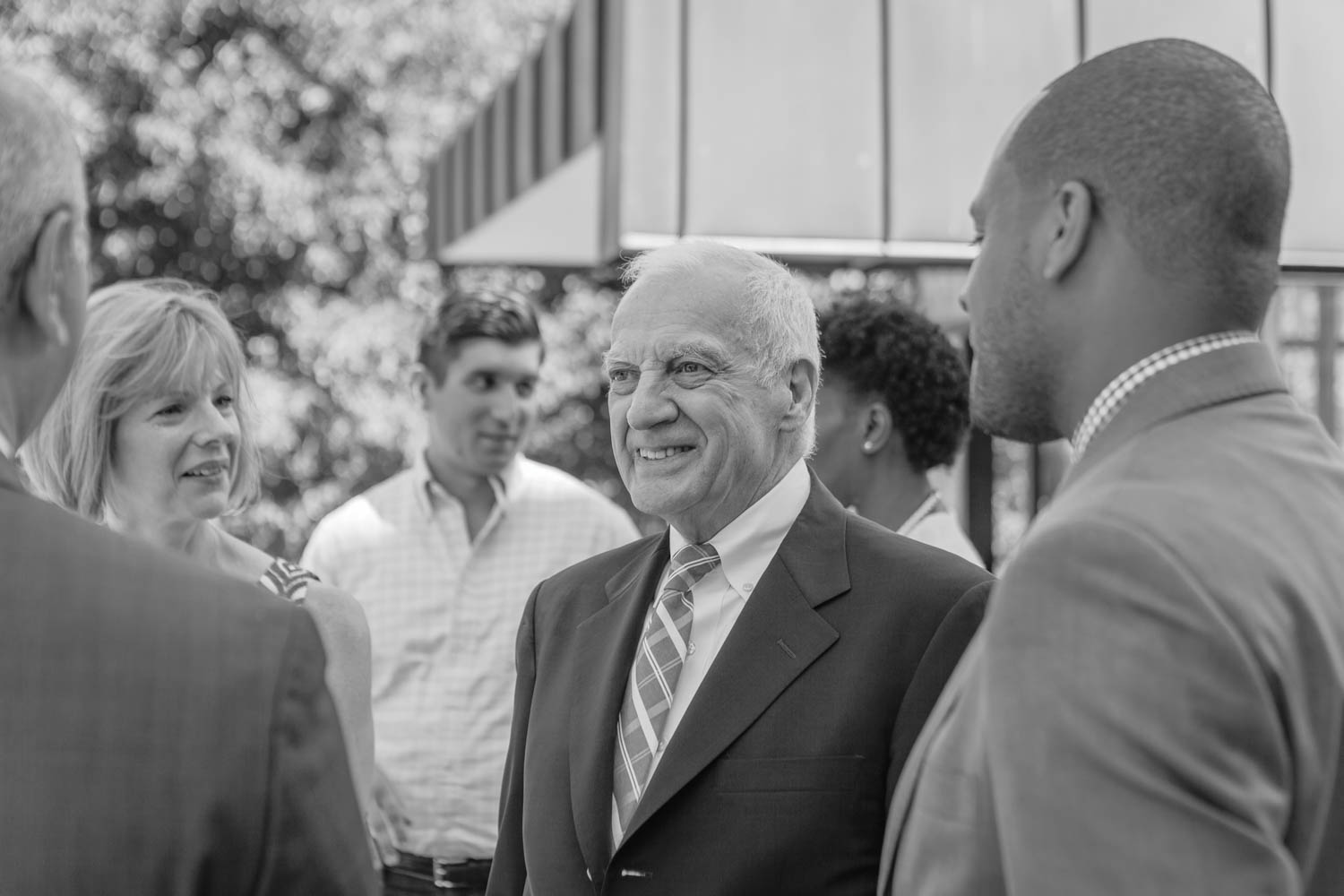 Pratt Institute President talking to multiple people