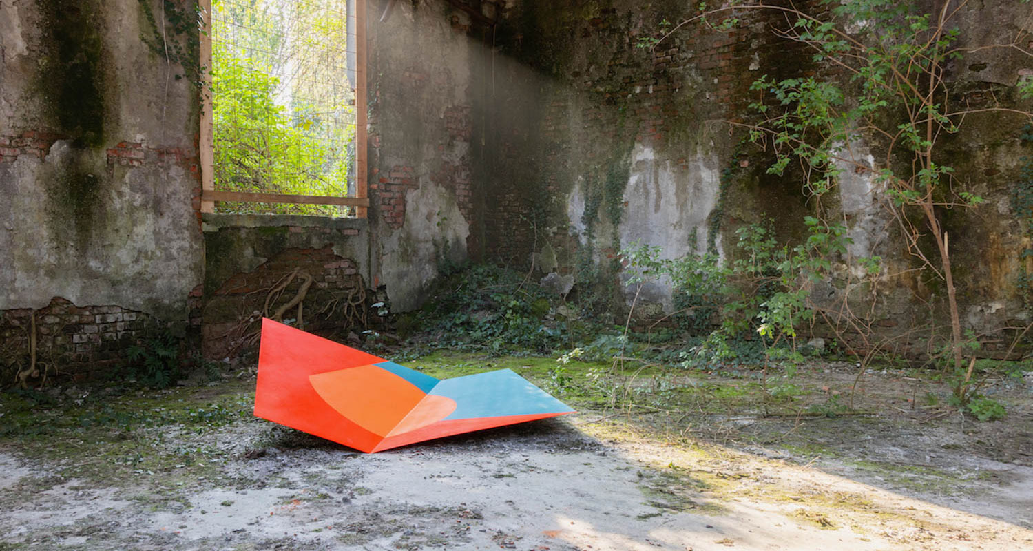 room with brightly colored art piece on floor