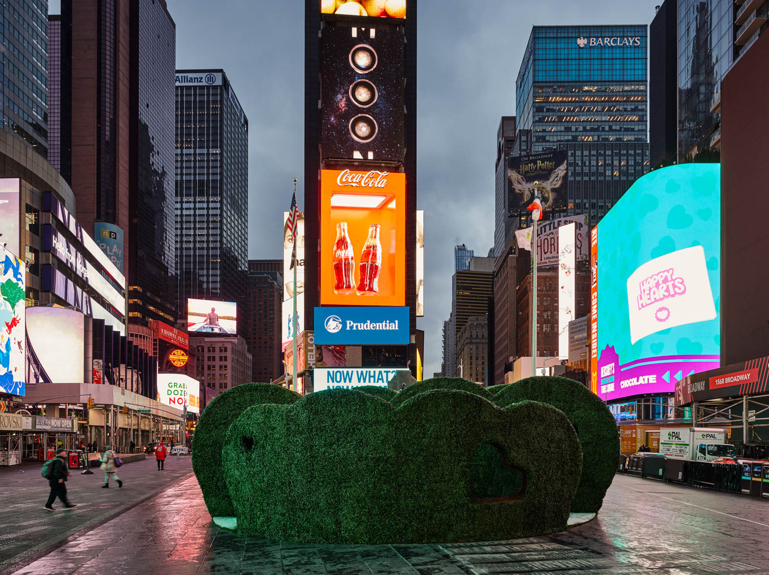 green pop up area in front in the midst of Times Square