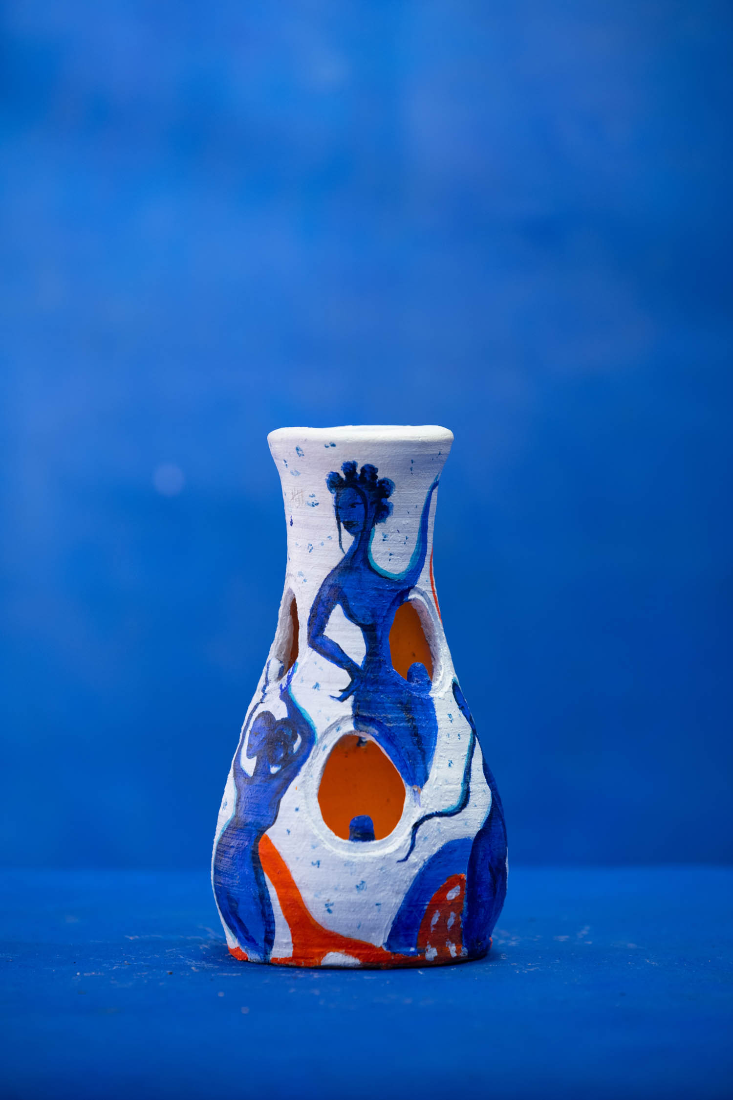white vase with image of woman on it