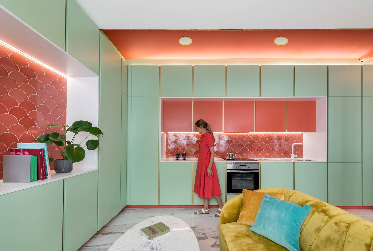 light pastel green kitchen with red tints