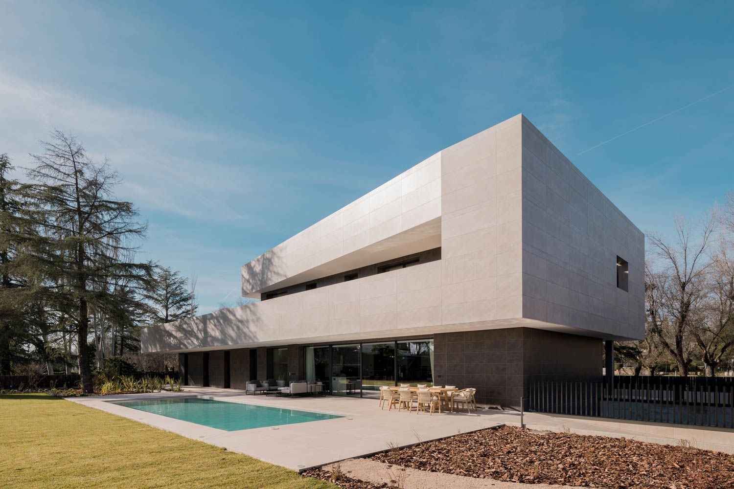 exterior of house with sharp pointed corners and pool