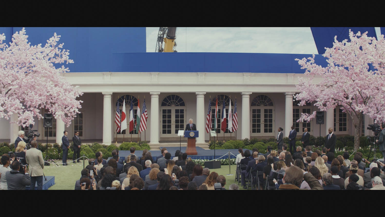 Harrison Ford standing on set in front of White House