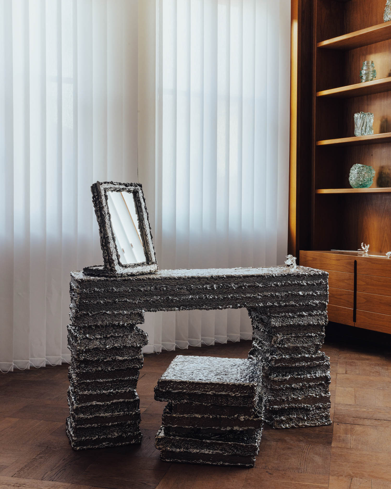 room with fuzzy stone desk and mirror