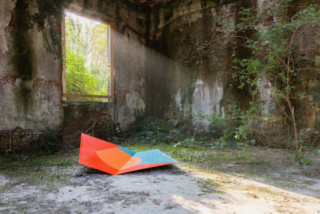 room with brightly colored art piece on floor