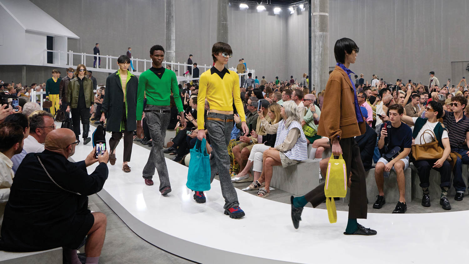 multiple people walking on runway