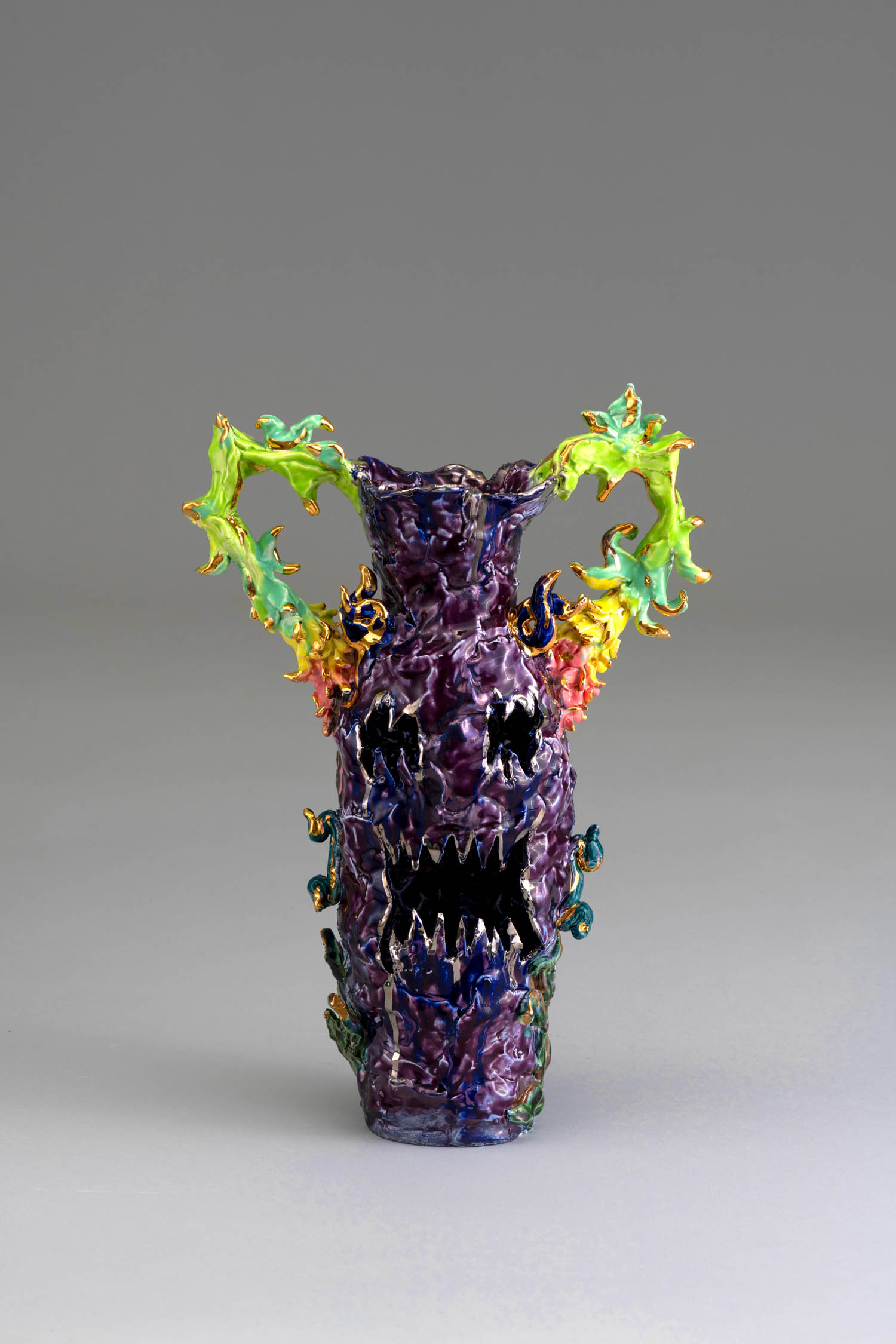 dark purple vase with green handles