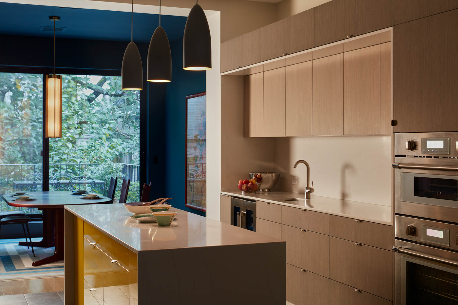 kitchen with wooden island and restrained lighting