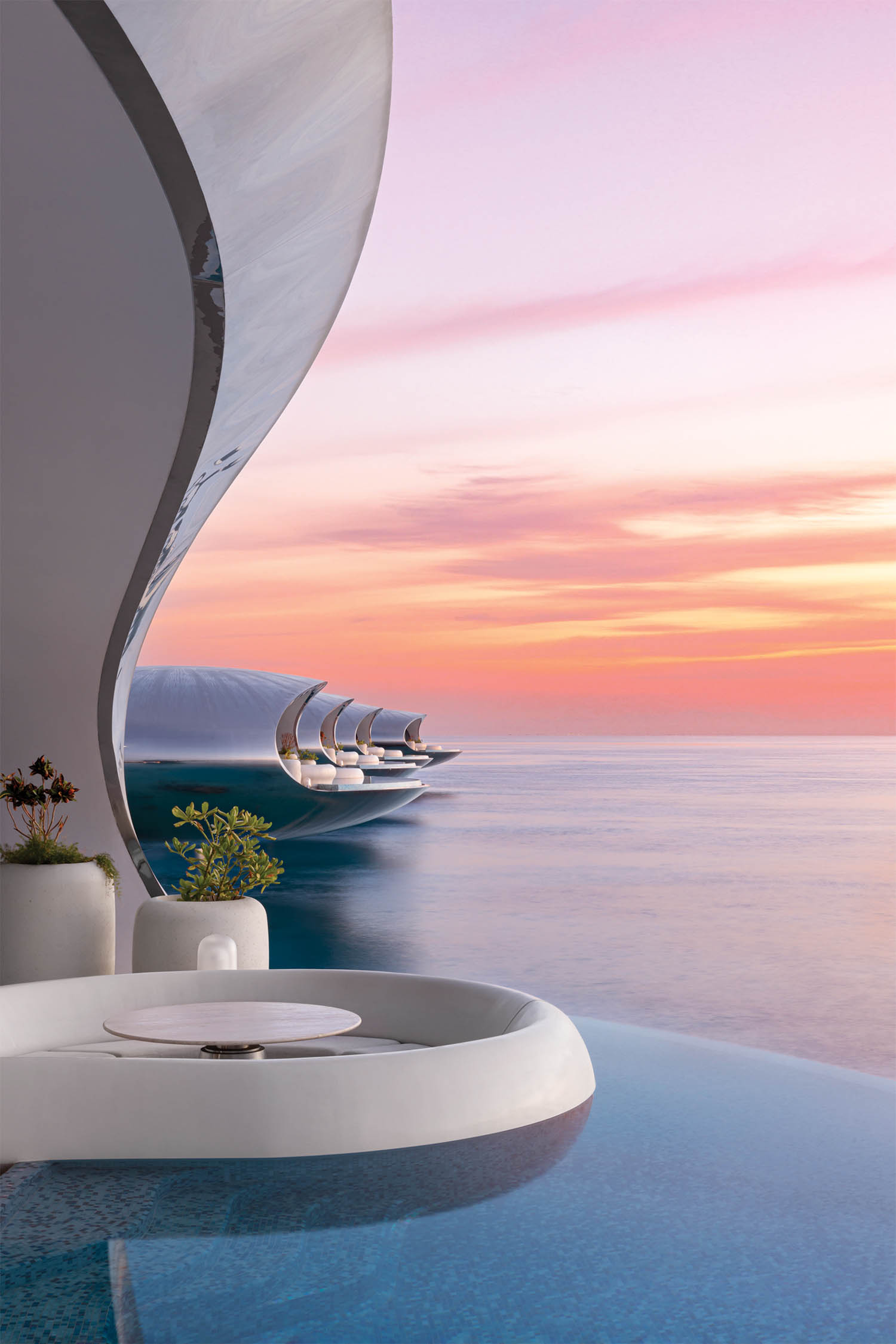 white pool deck seating overlooking the ocean