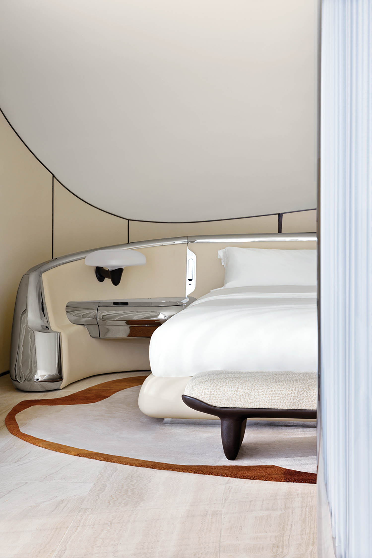 corner of room with white bed and carpet