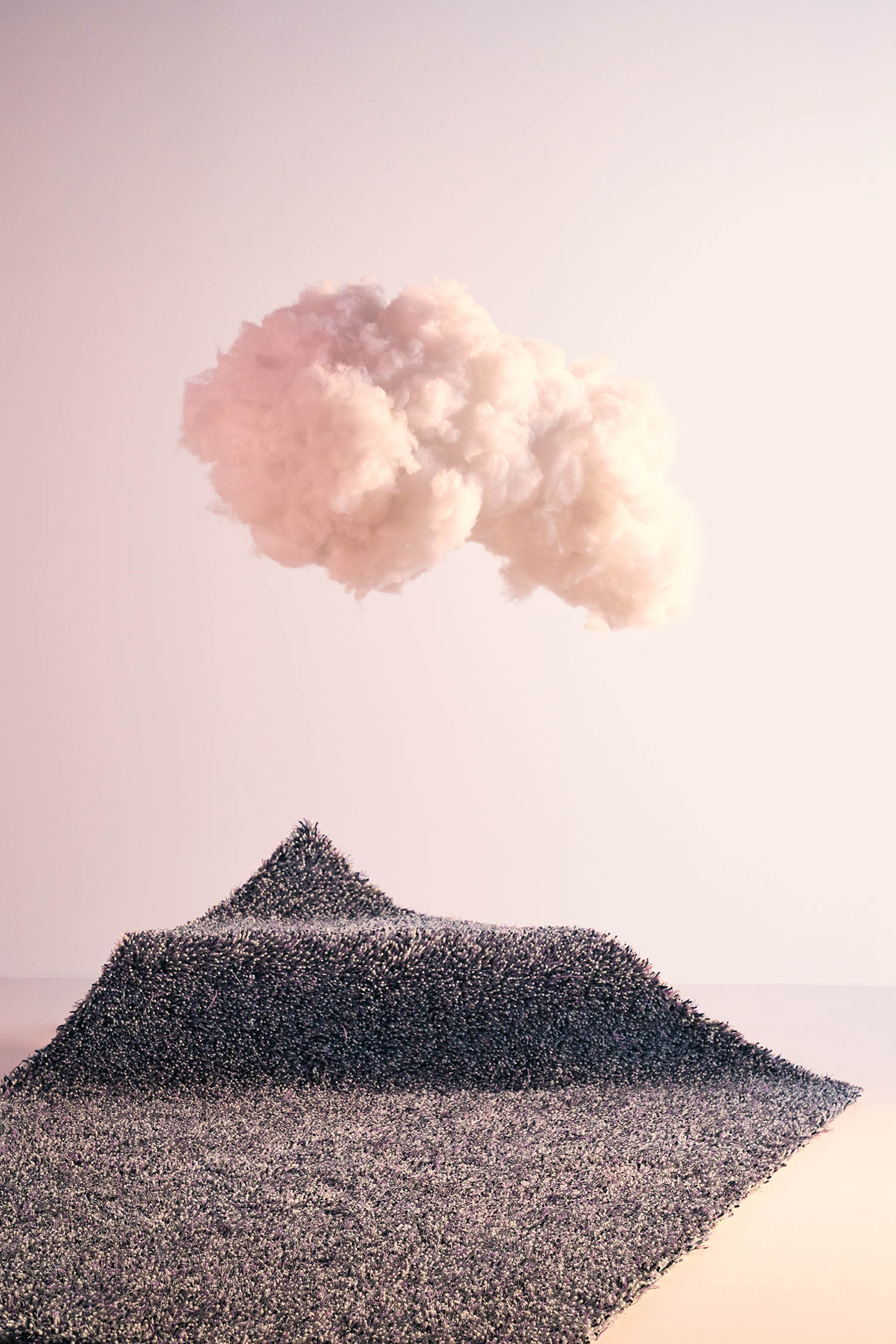 dark grey rug under a pink puff of smoke