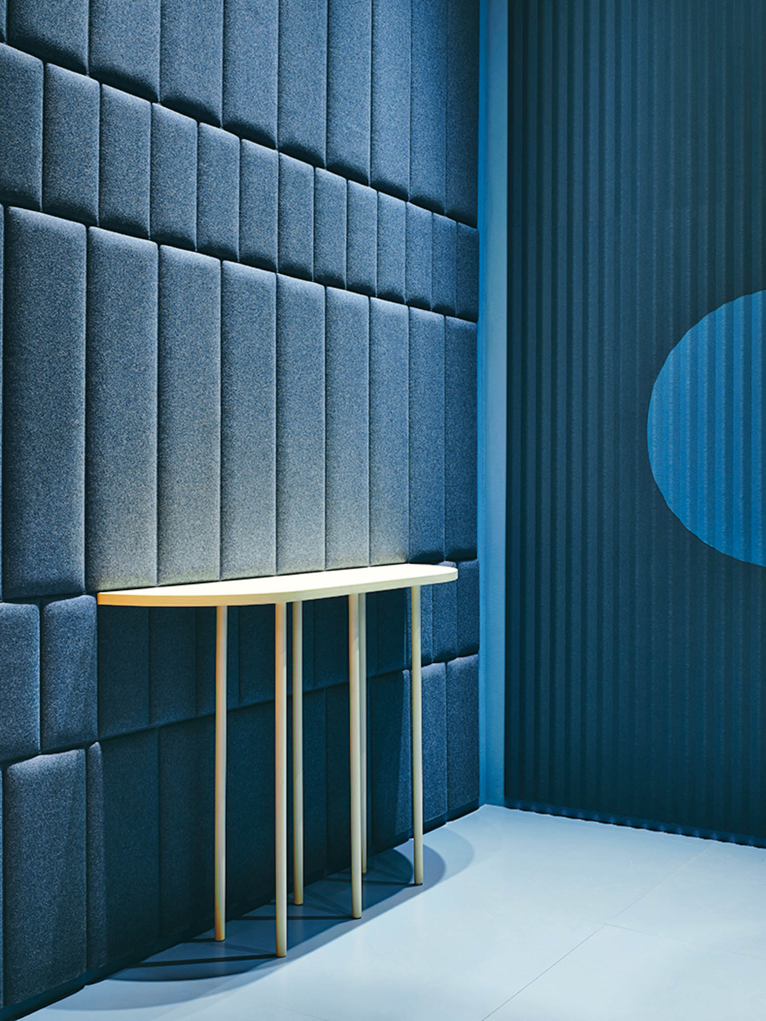 room with blue wallcovering and connected table