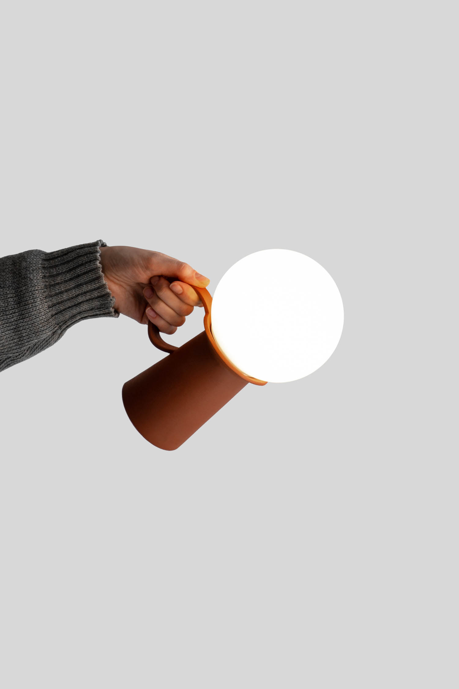 person holding a small lantern