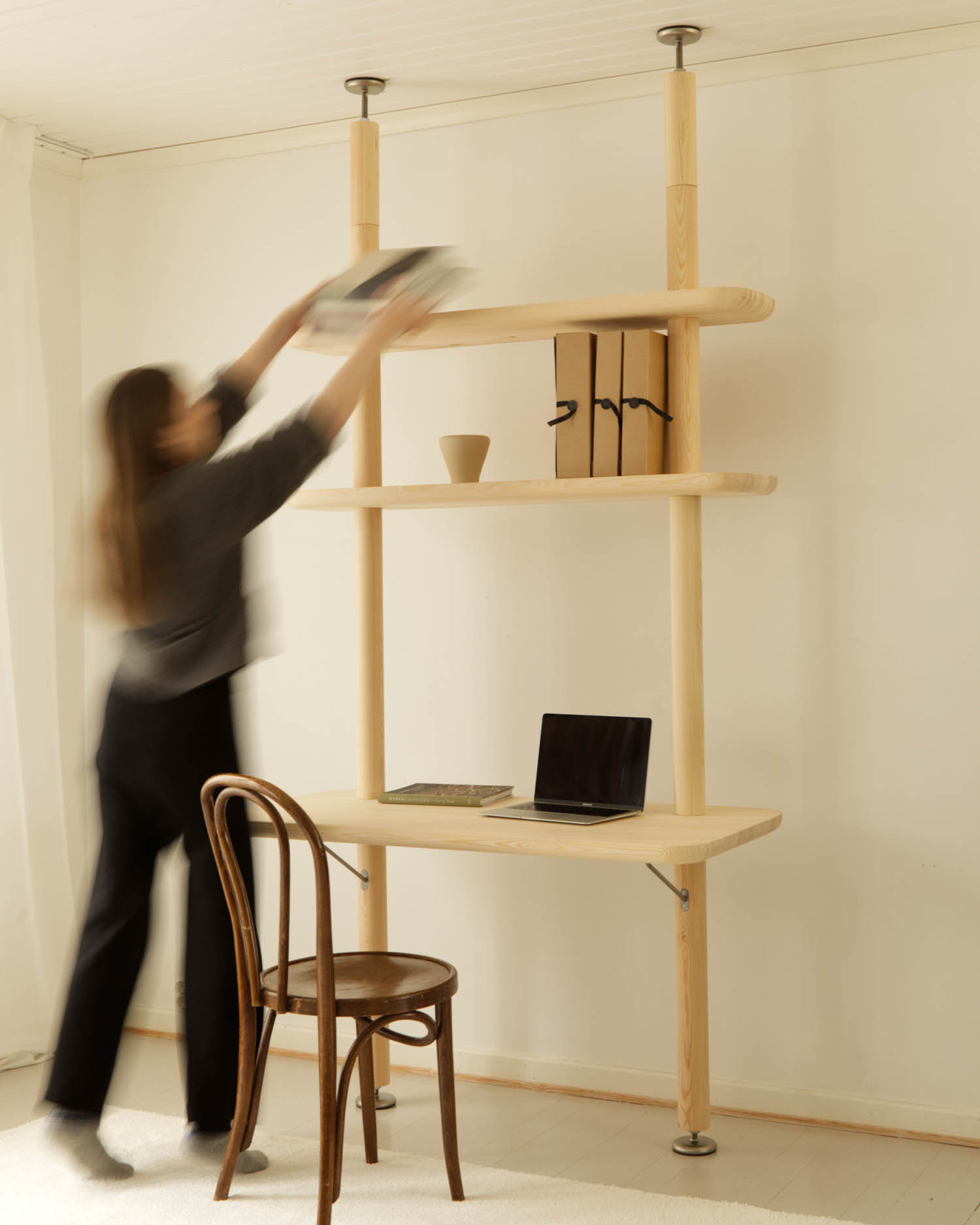 woman putting items on a shelf