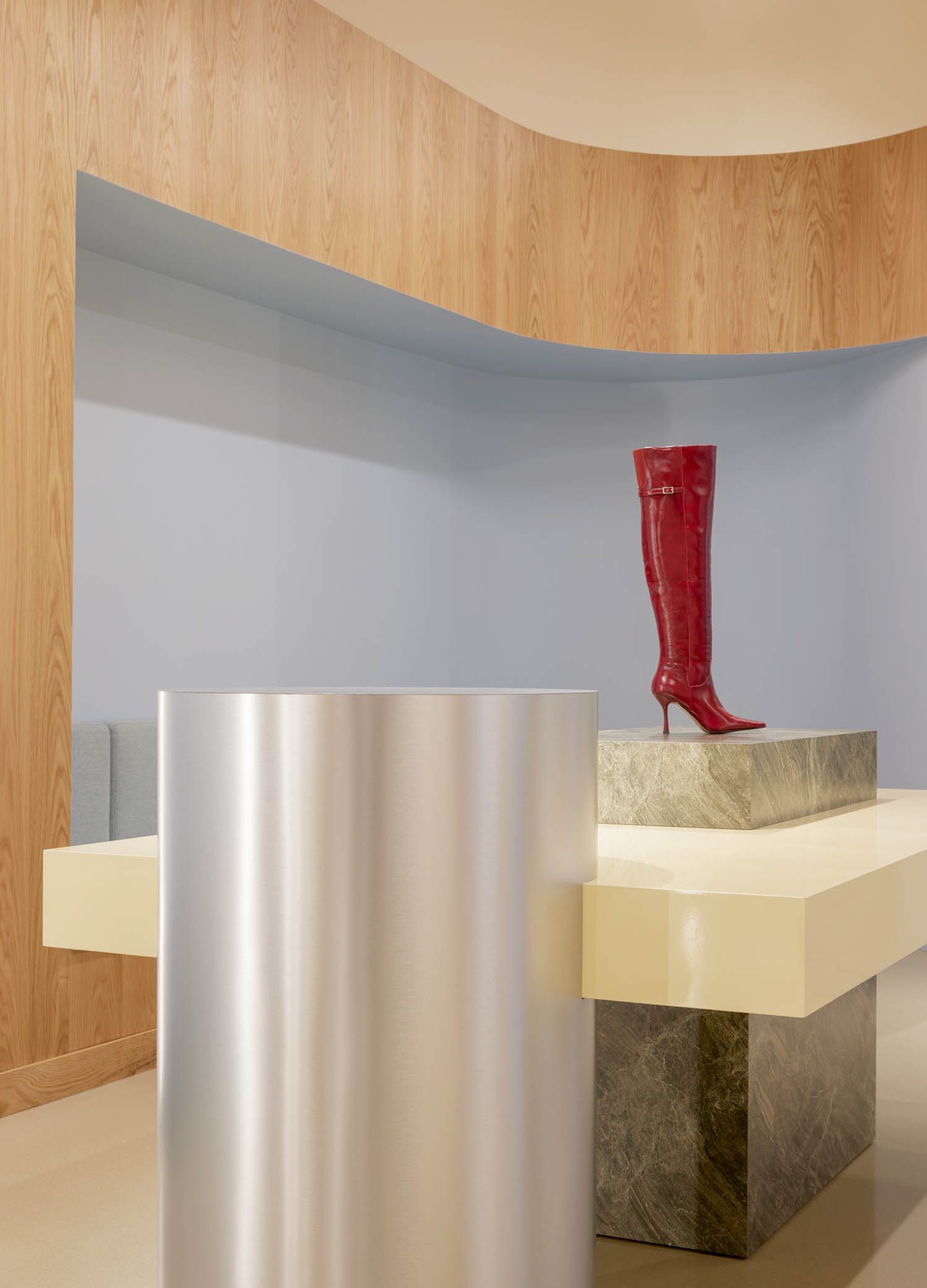 bright red boot on a table in the room