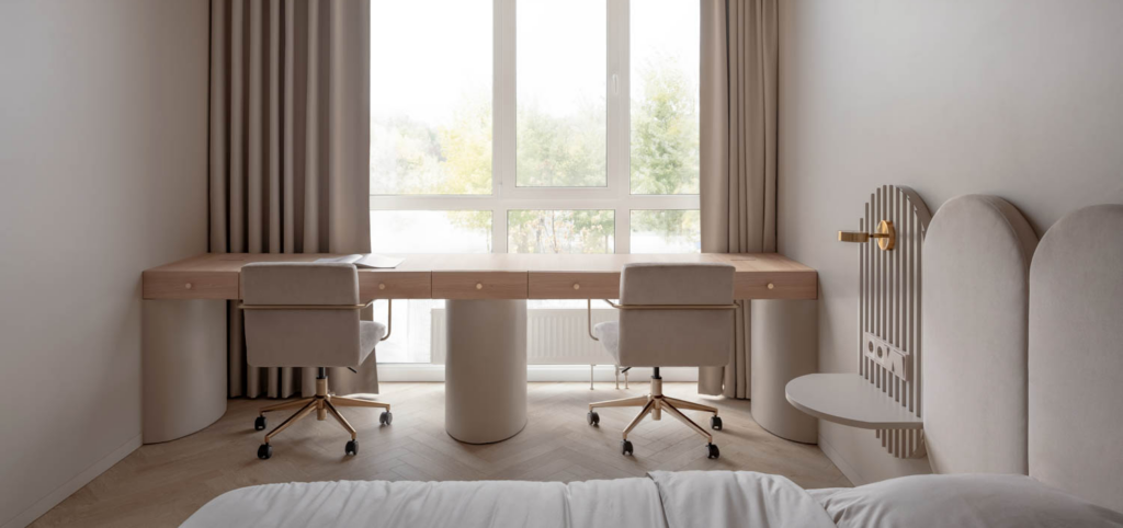 bedroom with long table and view of outside