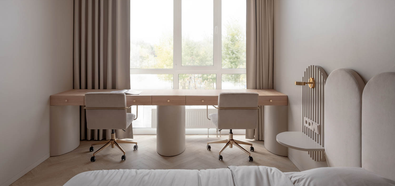 bedroom with long table and view of outside