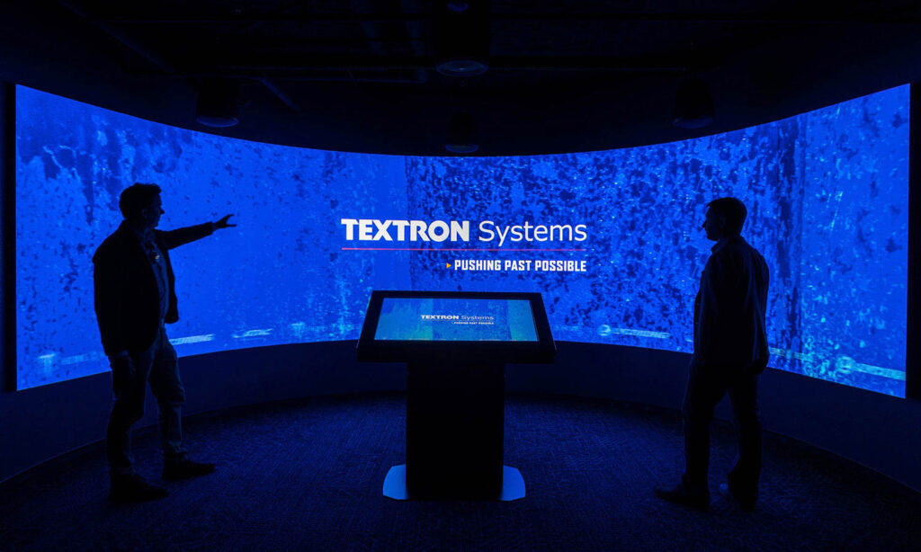a blue tech screen in a dark room