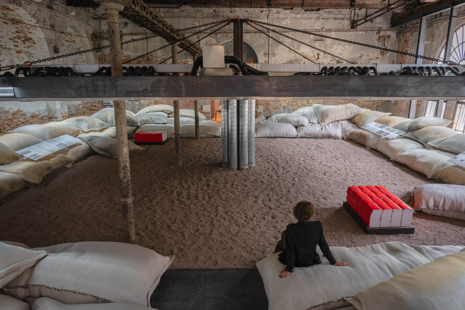 a person sitting in the bahrain pavilion at the venice biennale