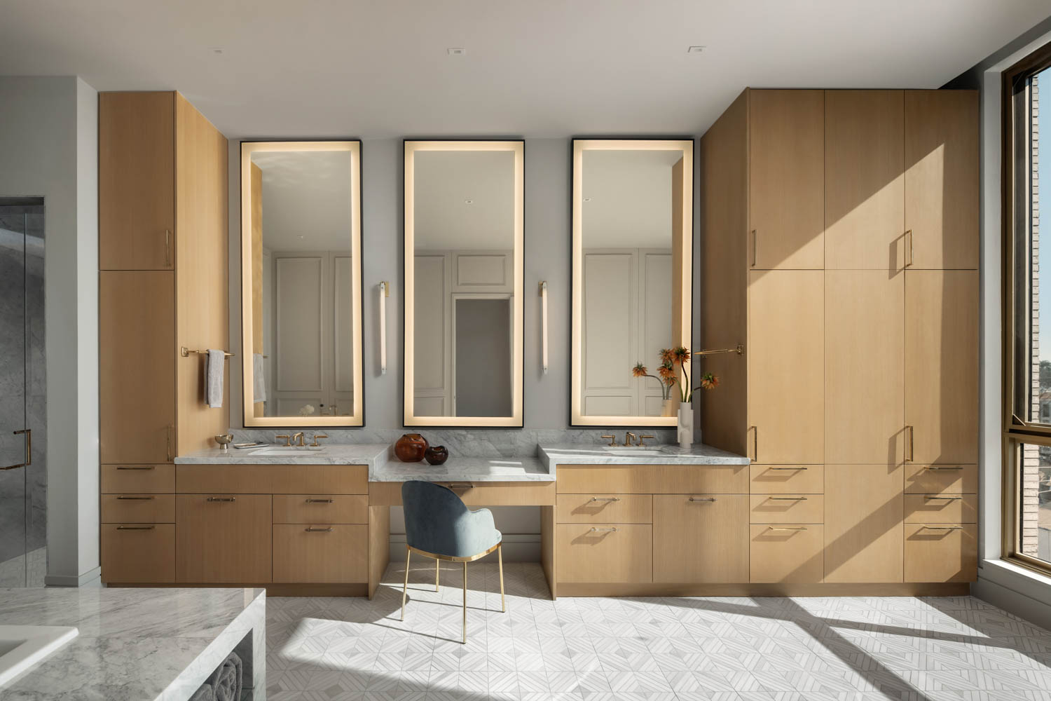 interior bathroom area with mirrors and cabinets