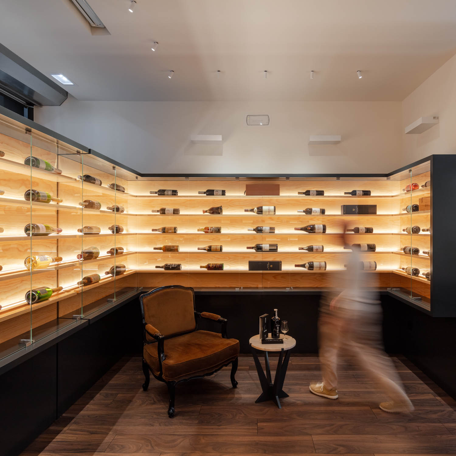 room with multiple shelves filled with bottles