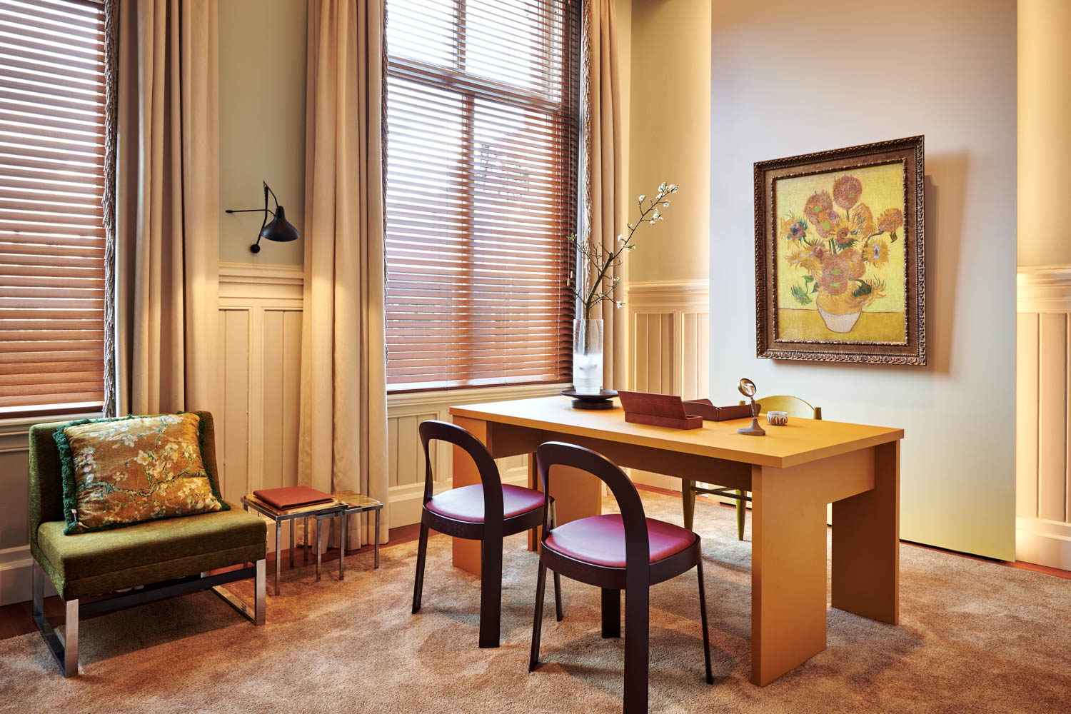 office area with yellow desk and sunflower painting